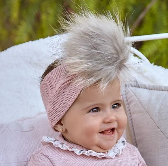 Knitted turban with fur pompom. two shades of pink
