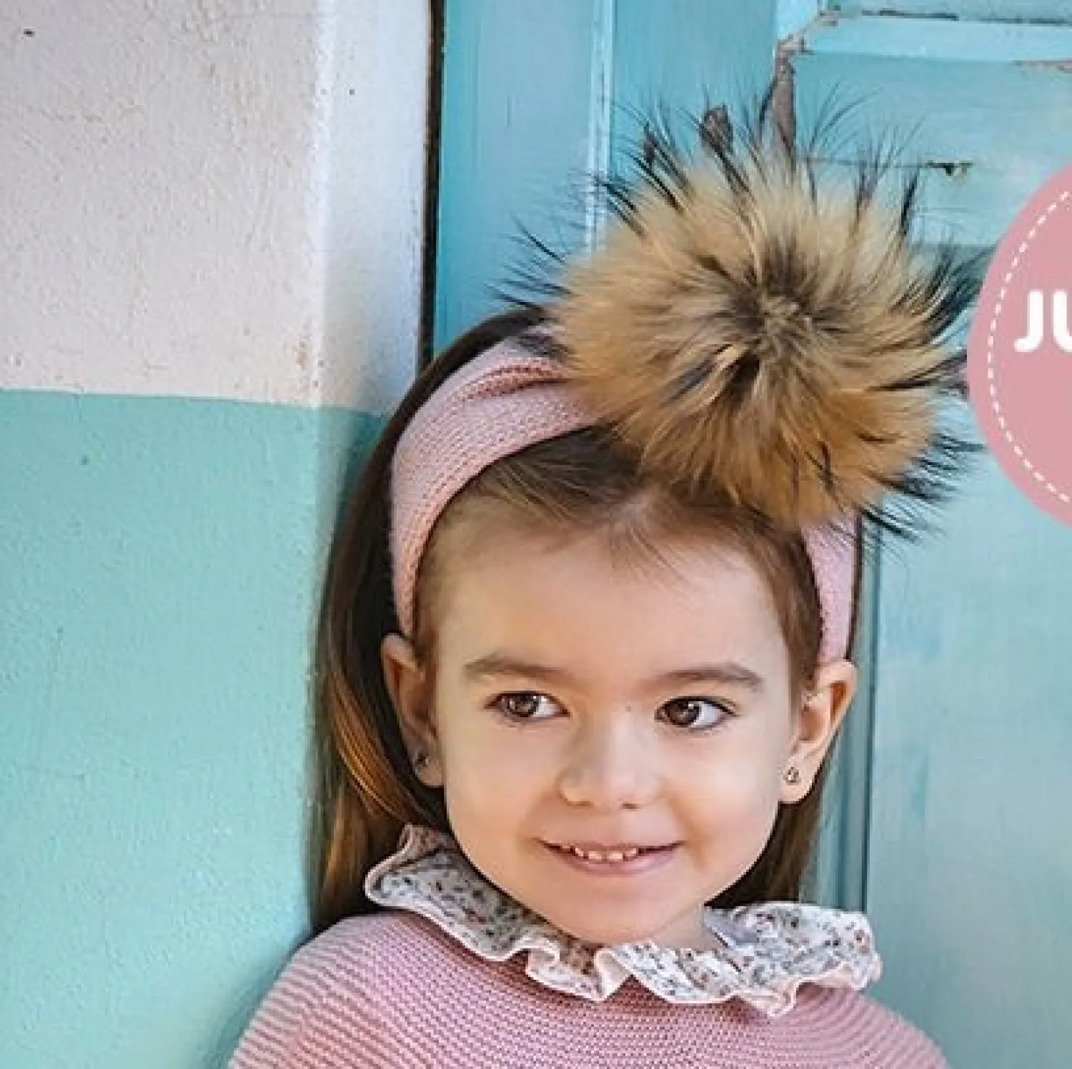 Knitted turban with fur pompom. two shades of pink